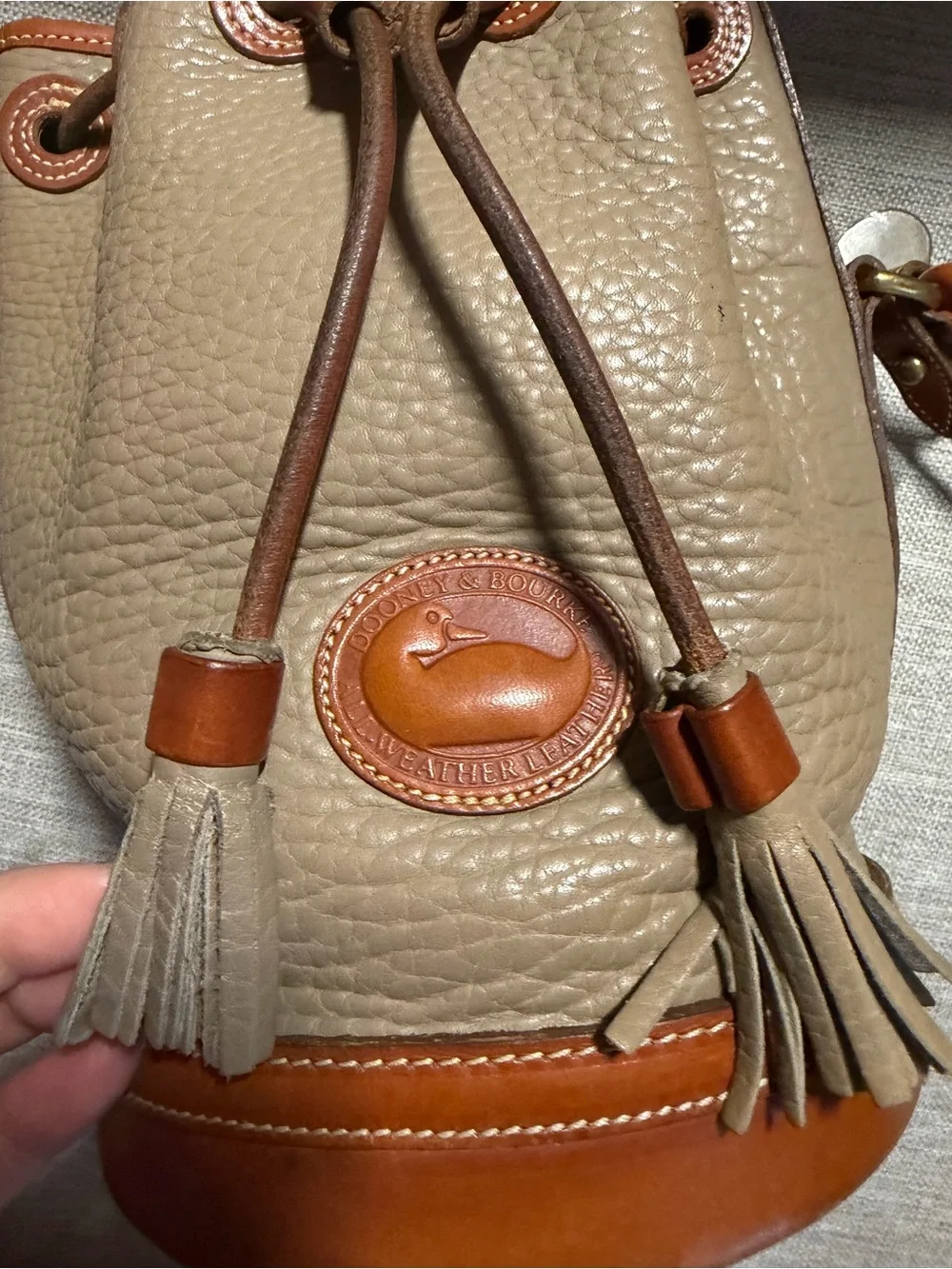 Dooney & Bourke Taupe Pebbled Leather Bucket Bag with Tan Trim